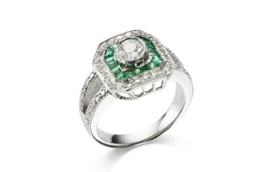 An emerald and diamond target cluster ring
