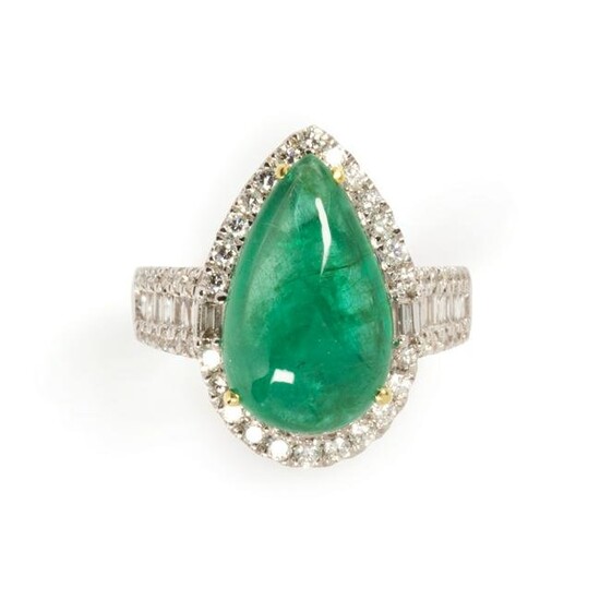 An emerald, diamond and eighteen karat white gold ring