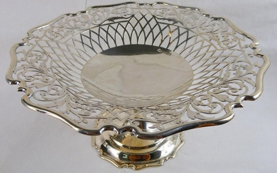 Beautiful sterling silver tazza with a finely pierced border with swirling leaves and arched lattice.Clear hallmarks for Sheffield 1908 and maker's mark for Henry Atkins. Weight 270 grammes. Height 11cm ~ Diam 21cm.