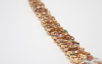 Bracelet en or, orné de diamants, saphirs, émeraudes et rubis, à motifs de lettres, poids...