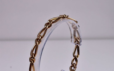 Bracelet gourmette en or 18K 750/1000e. Long. : 19,5 cm. Poids. : 29 g.