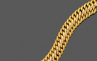 Bracelet maille américaine en or. En or jaune 18k large bracelet partiellement ciselé. Long. :...
