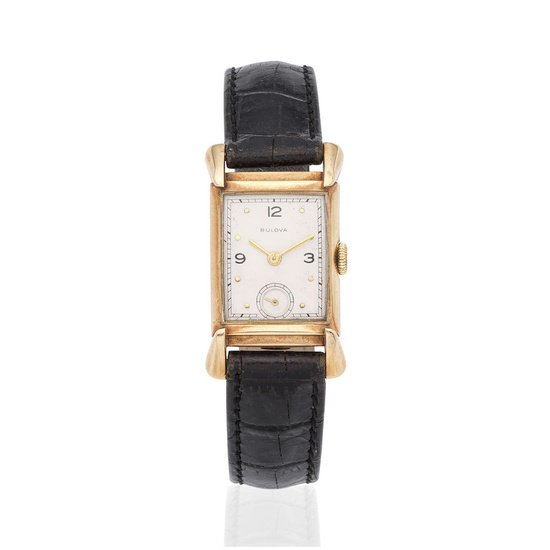 Bulova. A 14K gold manual wind wristwatch Bulova. Montre bracelet...
