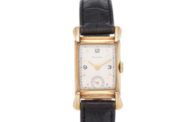 Bulova. A 14K gold manual wind wristwatch Bulova. Montre bracelet...