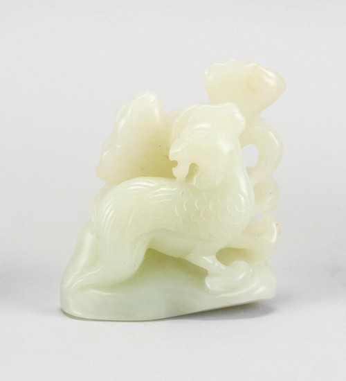 CHINESE CELADON JADE FIGURE GROUP With openwork carving depicting a phoenix standing with lotus pods. Height 3". Length 2.5".
