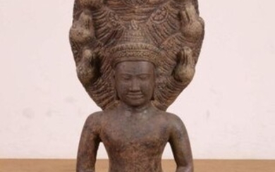 Cambodia, stone sculpture of seated Buddha, on lotus...
