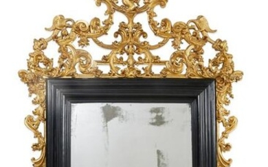 Continental Baroque giltwood and ebonized mirror