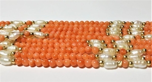 Coral necklace , gold and pearls.