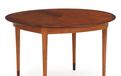 Danish cabinetmaker: “Yin/Yang”. Circular coffee table with beech frame. Top with teak and rosewood pattern, top rim and “shoes” of teak.