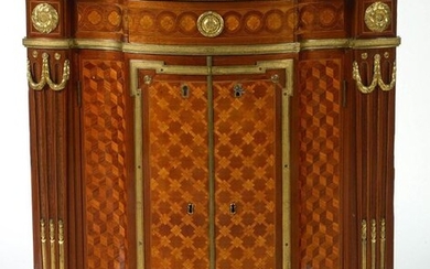 Exceptional Transition style corner in veneer and floral marquetry and "Cubes" opening with a drawer in the belt, front with a light central projection equipped with two doors. Quality ormolu ornamentation. Shelf in red Morello cherry marble. French...