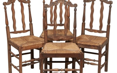 Four French Provincial Brittany Style Chairs, 20th c., the chairs with scrolled crests, wavy splats