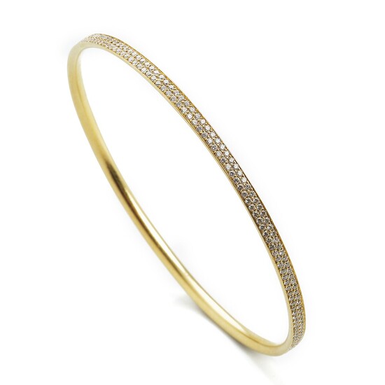 Georg Jensen: A diamond bangle “Magic” set with numerous brilliant-cut diamonds, mounted in 18k gold. Design 1513B. Size S.