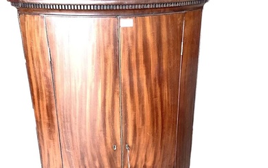 George III mahogany bow fronted, double door corner cupboard