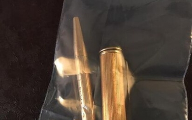 Gold lot including: a pencil signed CARTIER, a...