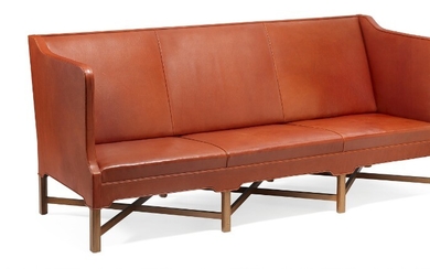 Kaare Klint: Freestanding three seater sofa on eight-legged, profiled mahogany cross-frame. Sides, seat and back upholstered with patinated red leather.