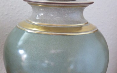 Knud Andersen, a.o.: Porcelain vase decorated in green and gold with patinated bronze lid. Royal Copenhagen. H. 30 cm.
