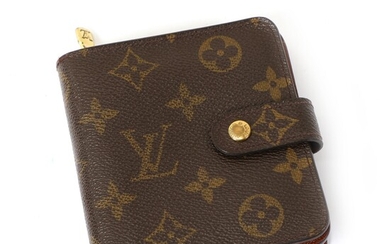 NOT SOLD. Louis Vuitton: A wallet made of brown mongoram canvas with gold toned hardware,...
