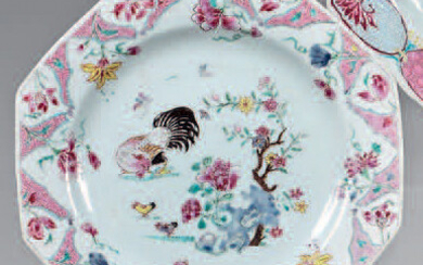Octagonal Chinese porcelain plate. Yongzheng (1723-1735). Decorated with the enamels of the Rose Family, in the center of a hen with its young near a flowery rock, the wing and the fall of a large frieze of flowers and pink cartouches in the form of a...