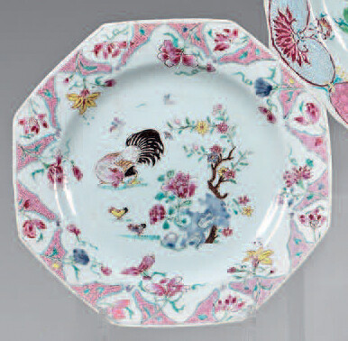 Octagonal Chinese porcelain plate. Yongzheng (1723-1735). Decorated with the enamels of the Rose Family, in the center of a hen with its young near a flowery rock, the wing and the fall of a large frieze of flowers and pink cartouches in the form of a...