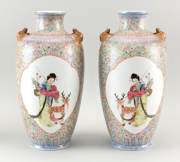 PAIR OF CHINESE FAMILLE ROSE PORCELAIN VASES In rouleau form, with gilt bat-form handles at shoulder and decoration of figural reser...