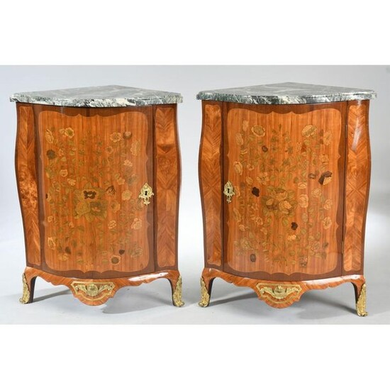 PAIR OF LARGE LOUIS XV COVERS with curved front and curved sides entirely inlaid with a rich floral decoration. They open by a door. They rest on small curved feet. Beautiful ornamentation of gilded bronzes. White marble top, veined green. Stamped...