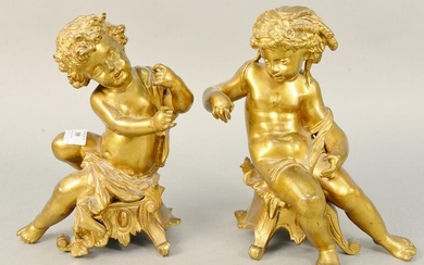 Pair French style bronze putti figures both in seated