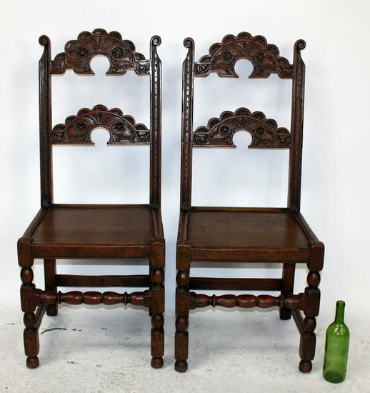 Pair of English oak carved back side chairs