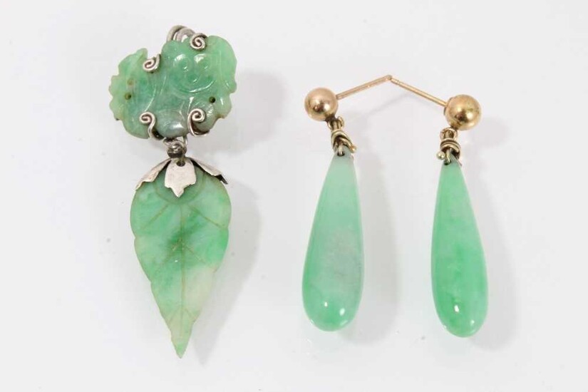 Pair of jade/green hardstone pendant earrings, each with a single pear-shape drop, 35mm, together with a single carved jade earring