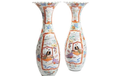 Pair of trumpet vases in porcelainJapan Kutani, late 19th centurywith polychrome decoration on a white background with characters, floral and vegetable motifs, restorations, break on the opening of a vase h 108 cm