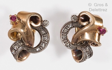 Pair of yellow gold and silver "Volutes" earrings, decorated with...