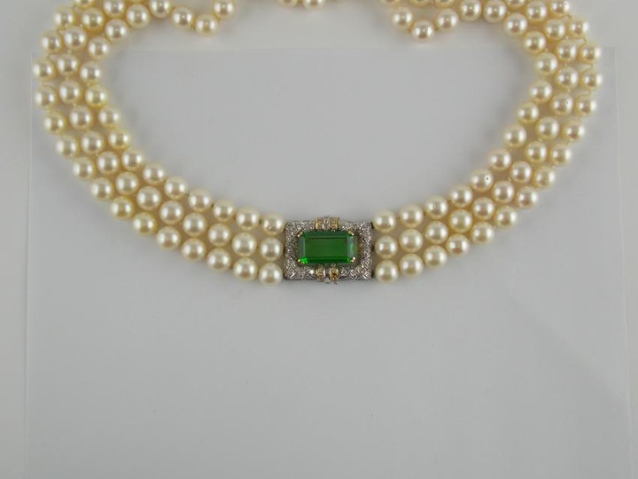Pearls three strand neckale with 18 K gold clasp.