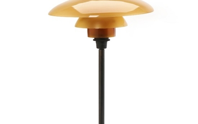 Poul Henningsen: “PH-3/2”. Table lamp with browned brass frame. Shade of amber coloured glass. Manufactured by Louis Poulsen.