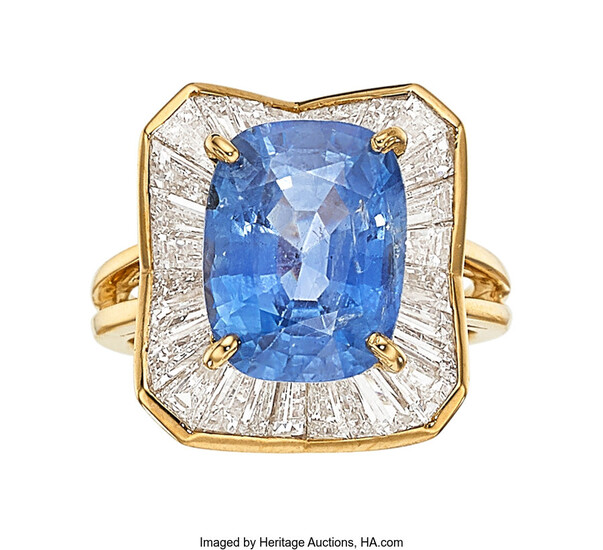 Sapphire, Diamond, Gold Ring The ring features a cushion-shaped...