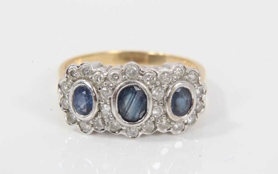 Sapphire and diamond triple cluster ring with three oval mixed cut blue sapphires surrounded by brilliant cut diamonds estimated to weigh approximately 0.50cts in total, on 18ct gold shank. Ring si...