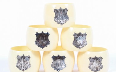 Set of six silver mounted napkin rings, each with shield shaped mount engraved with the initial M