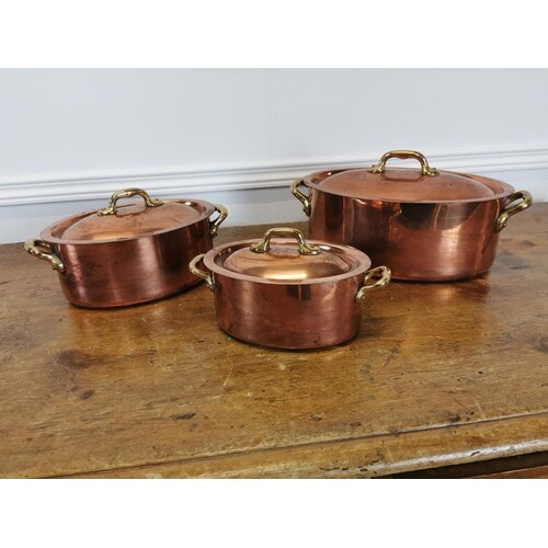Set of three exceptional quality copper lidded sauce pans wi...