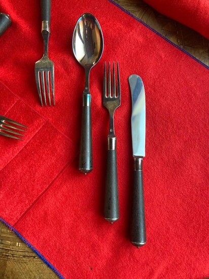 Silver plated metal and ebony wood cutlery from the goldsmith...