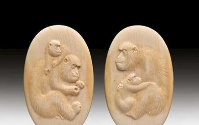TWO MEDAILLONS FINELY CARVED WITH MONKEYS.