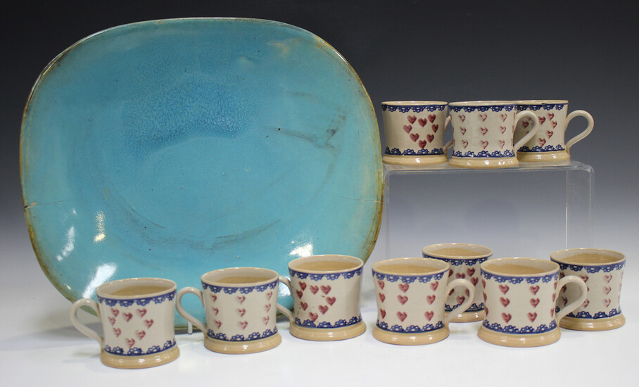 Ten Nicholas Mosse Pottery small mugs, painted with hearts within blue banding, black printed marks