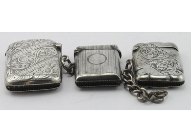 Three silver vesta cases hallmarked Birm. 1902, 1918 & 1921,...