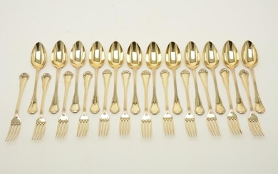 Twenty-four-piece French silver gilt spoons and forks.