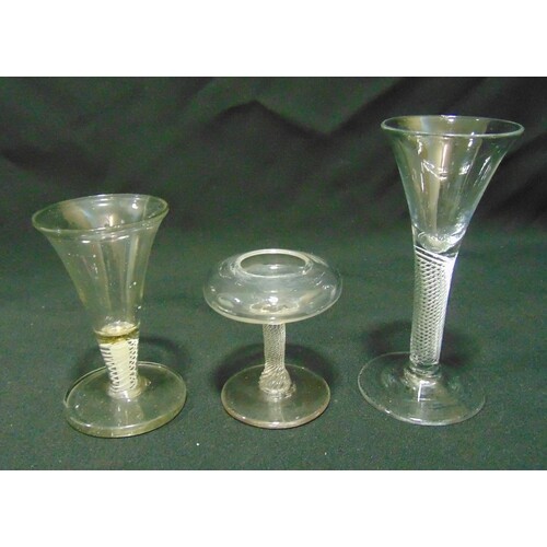 Two 19th century toasting glasses with spiral twist stems on...