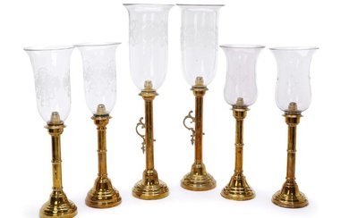 Two pair ond two single 19th-20th century brass hurricanes with glass shades....