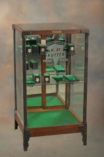 Unique antique oak and glass floor model Showcase with etched window advertising "Shapleigh's Keen