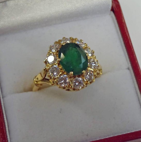 18CT GOLD, EMERALD AND DIAMOND CLUSTER RING, THE OVAL...
