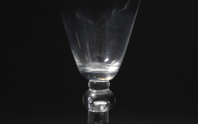 A baluster wine glass with an acorn knop, circa 1725