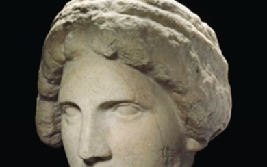 A GREEK MARBLE HEAD OF A GODDESS, CLASSICAL PERIOD, CIRCA 4TH CENTURY B.C.