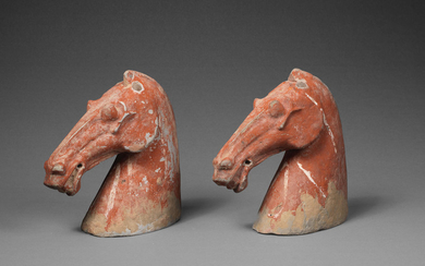 A pair of pottery horse heads