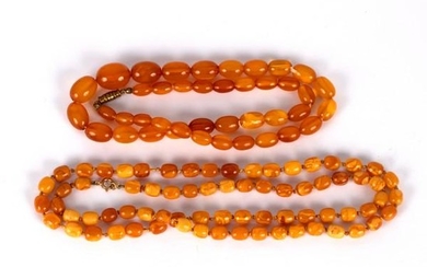 A single row of Baltic amber barrel shaped beads, 72cm