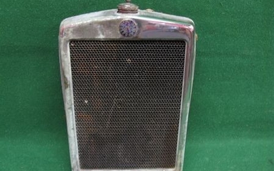 Upright Morris Minor radiator with chrome surround, enamel badge and cap
